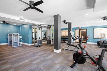 Cardio and strength training fitness center with peloton bike and lifefitness equipment